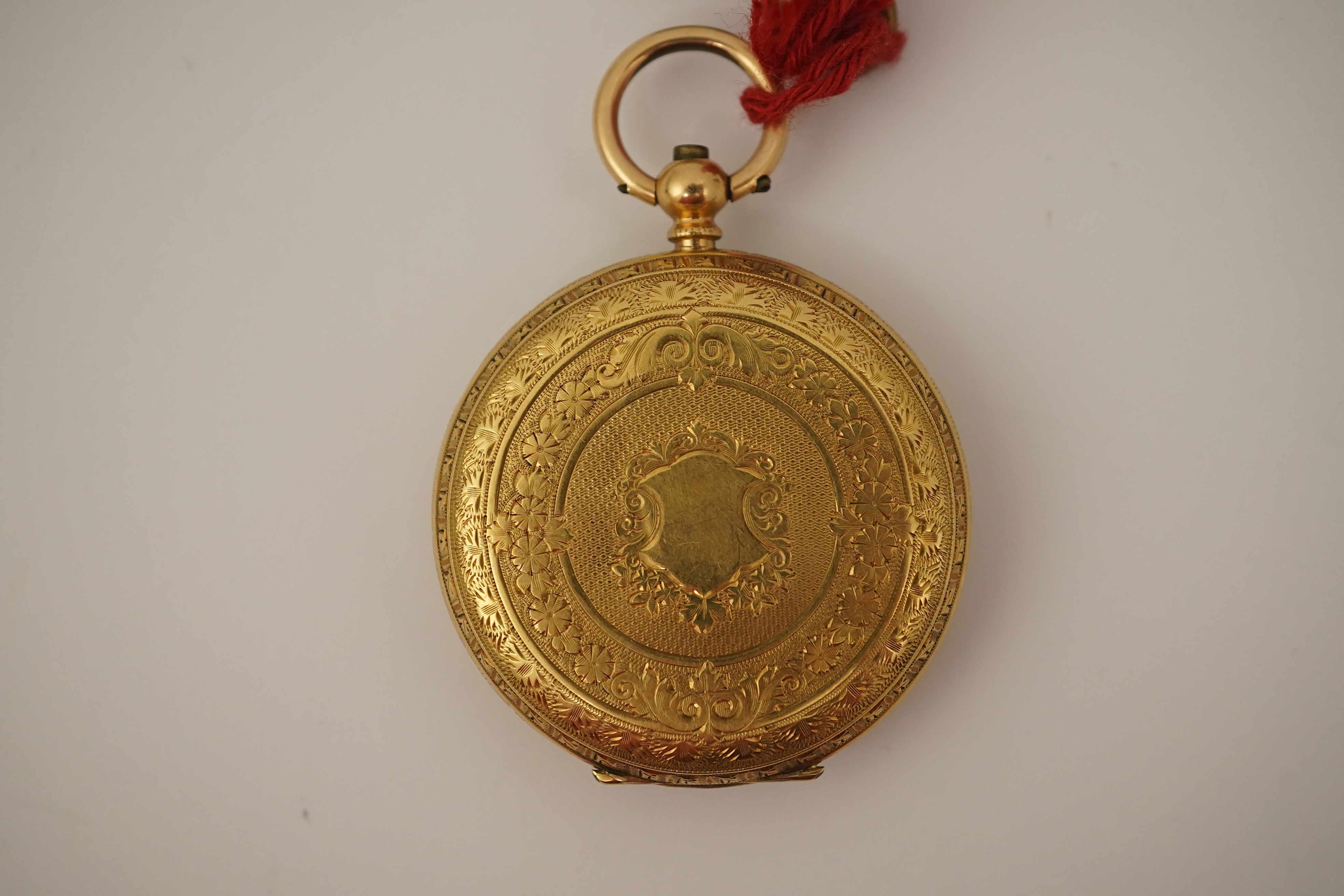 An early 20th century continental engraved 18k gold open faced fob watch